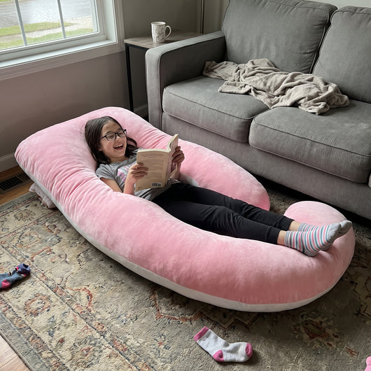 Kid relaxing at home on a Sleepy Miles pillow